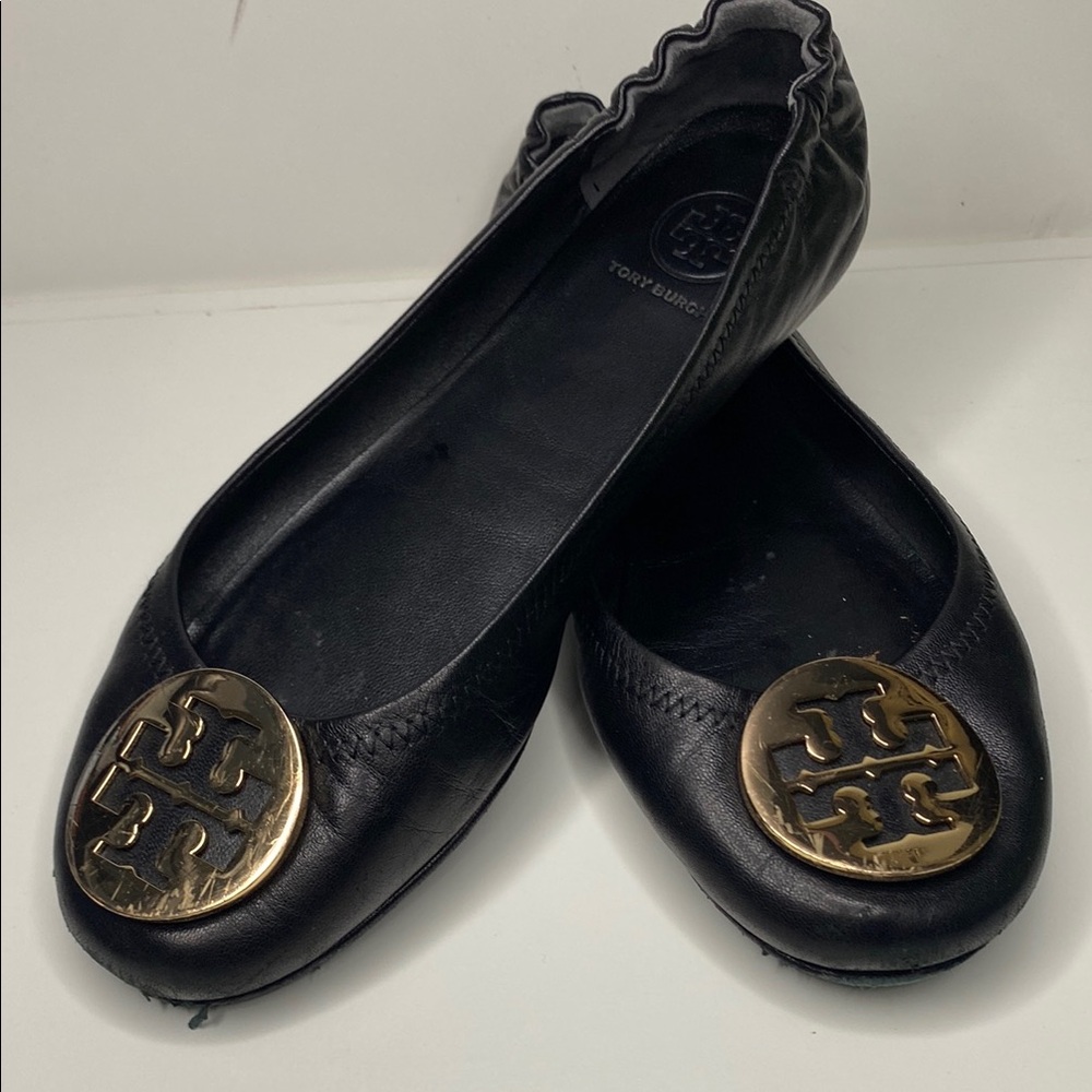 Tory Burch Black and Gold Flats with Medallion Logo